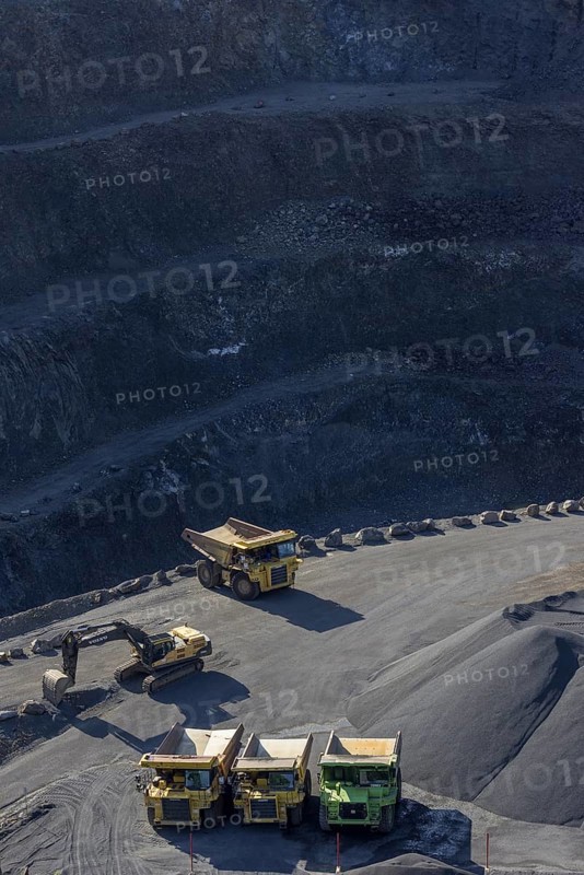 Tipper loader and excavator in a basalt quarry