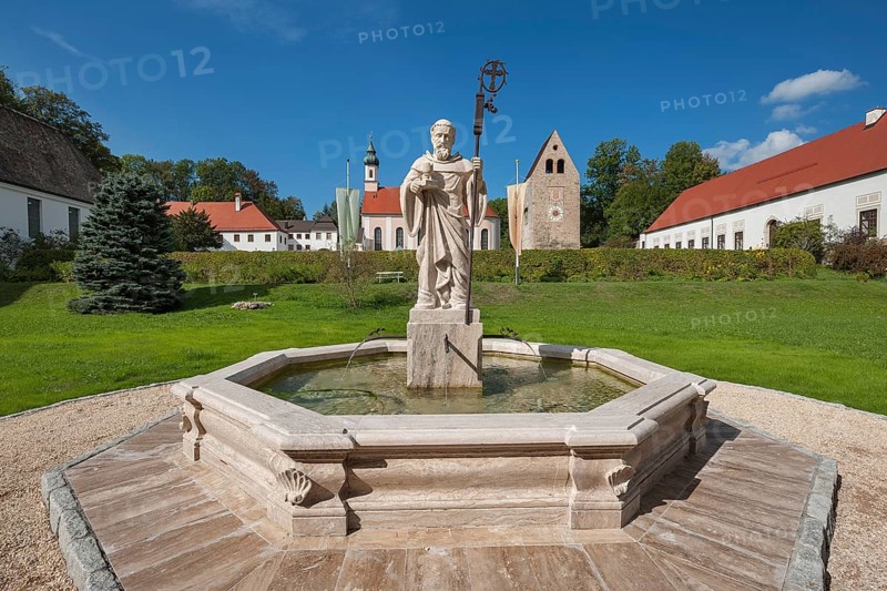 Monastery church with Roman tower and fountain with fountain figure of abbot Walto or Balto