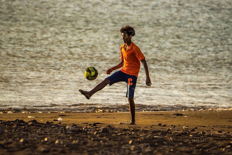 Teenager playing soccer