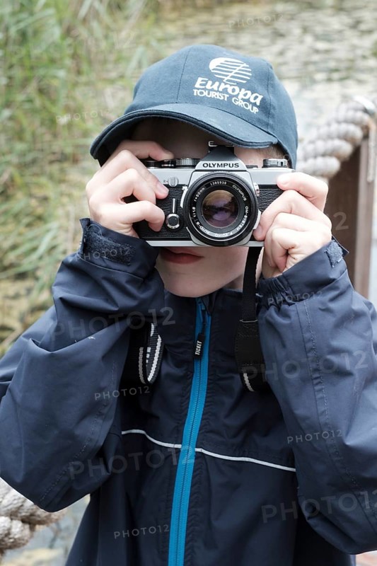 Child photographed with reflex camera
