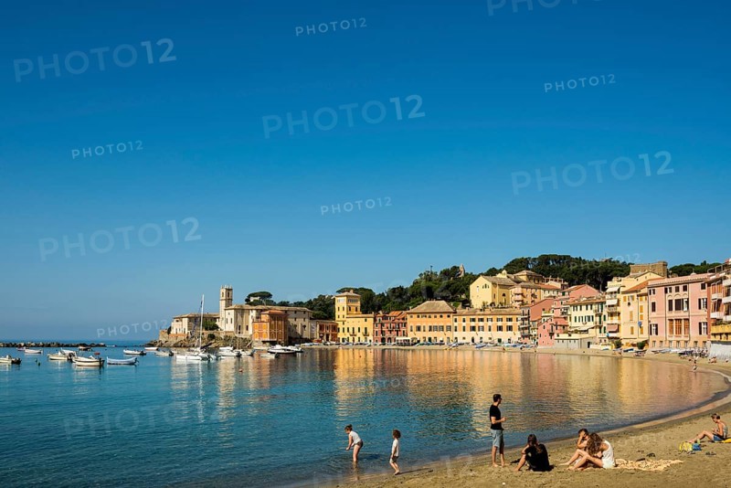 People on the beach in the bay Baia del Silenzio