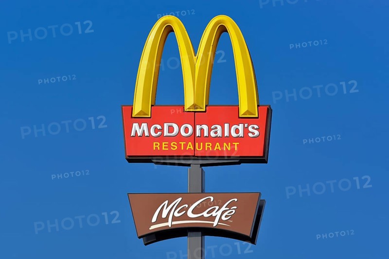 McDonalds sign against a blue sky