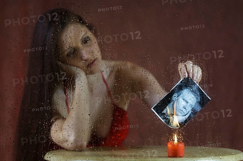 Woman behind a pane of glass