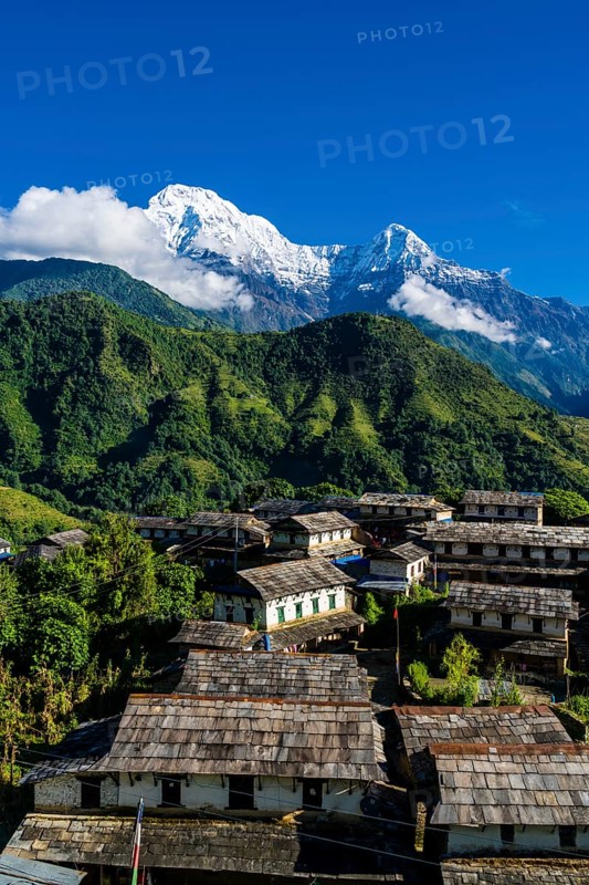 View on the historical village with the mountains Annapurna South