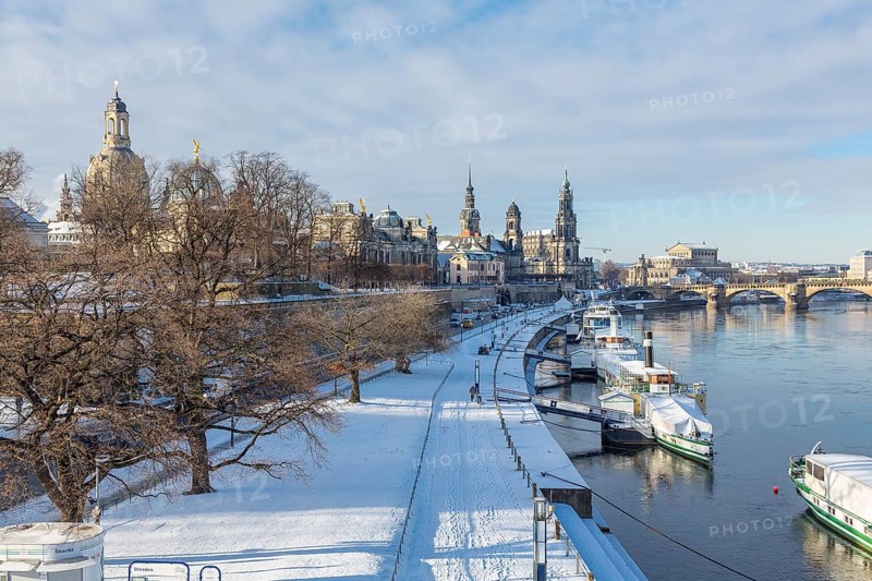 Snowy historic centre with Elbe and pier for steamboats