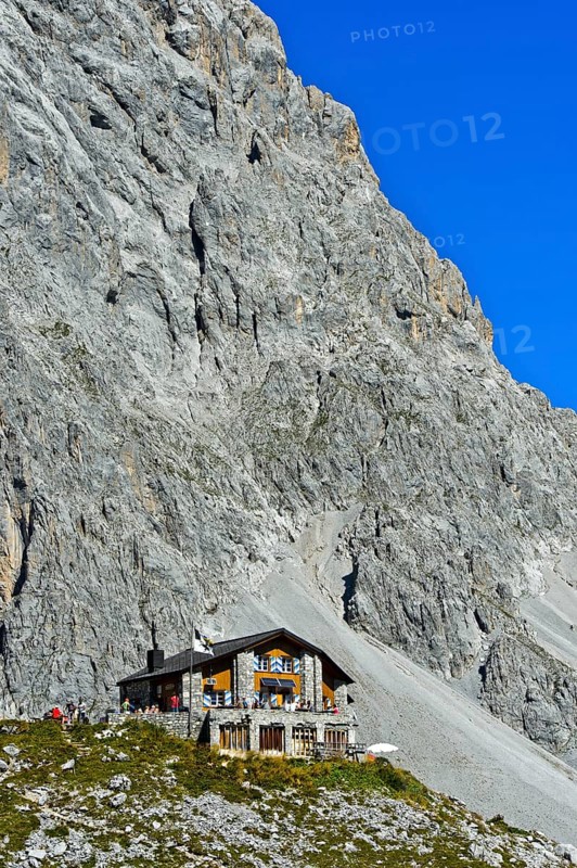 Carschinahutte in front of rock wall of Sulzfluh