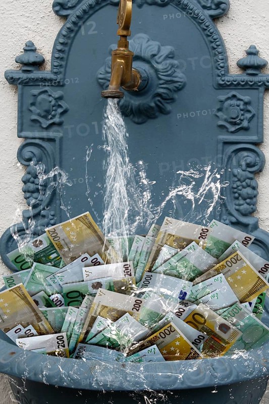 Counterfeit money in fountain with water running