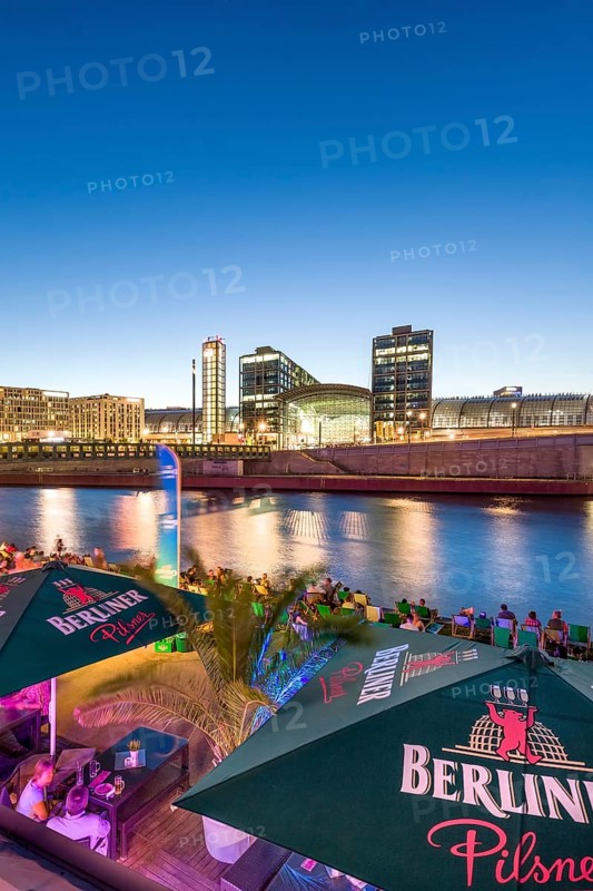 Beach bar Capital Beach at dusk at the river Spree opposite central railway station