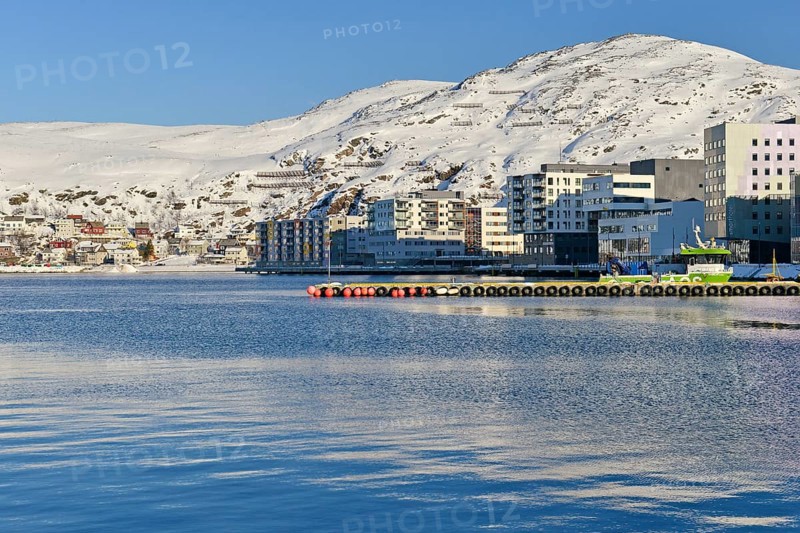 Snow-white bay with residential buildings