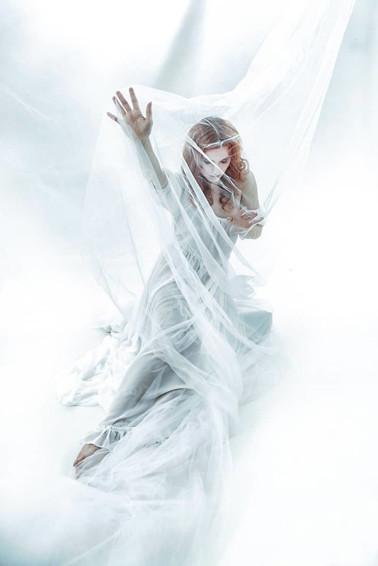 Redhead maiden woman in white cloth