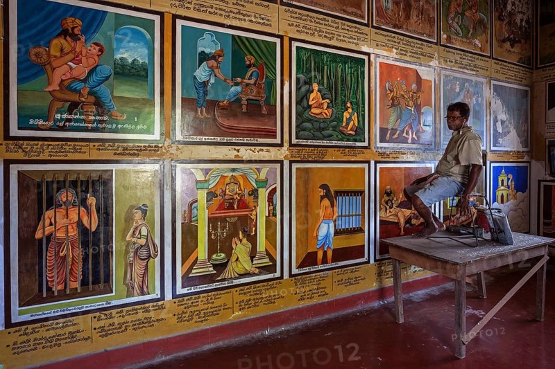 Singhalese man restoring murals