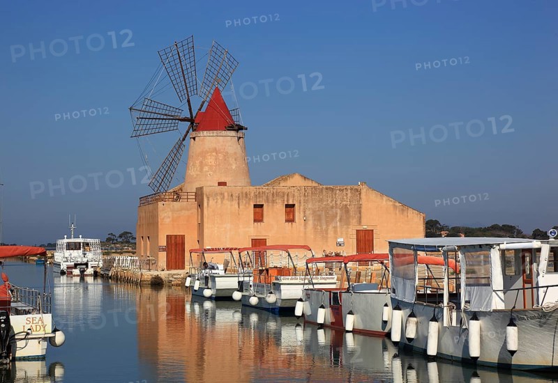 Windmill and boats at the salt flats