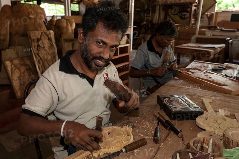 Native Sinhalese men carving traditional objects