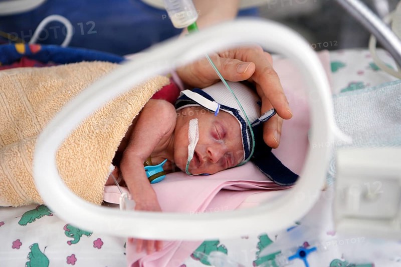 Incubator with newborn baby