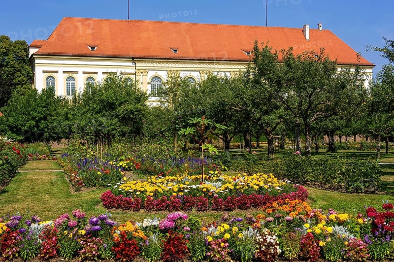 Colorful flower beds and historical orchard