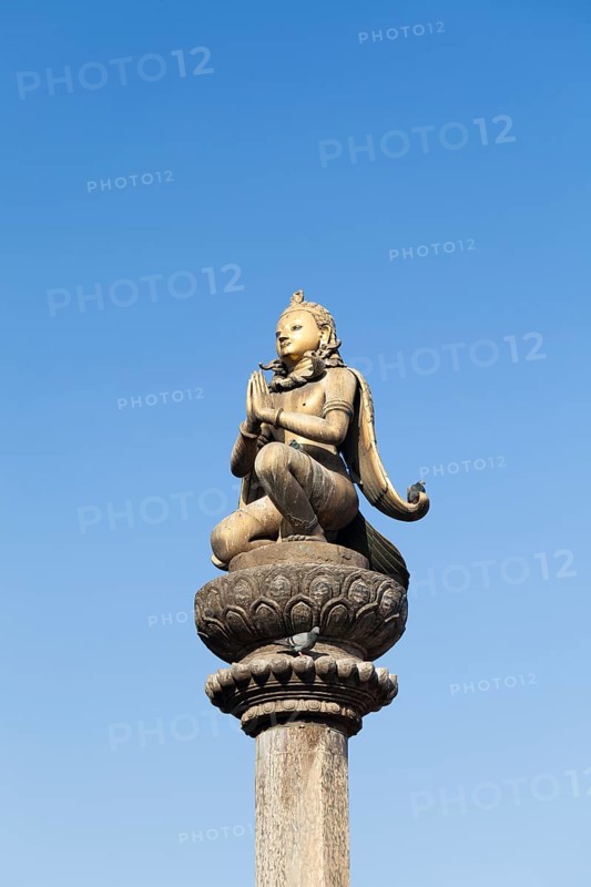Golden statue of Garuda on a column