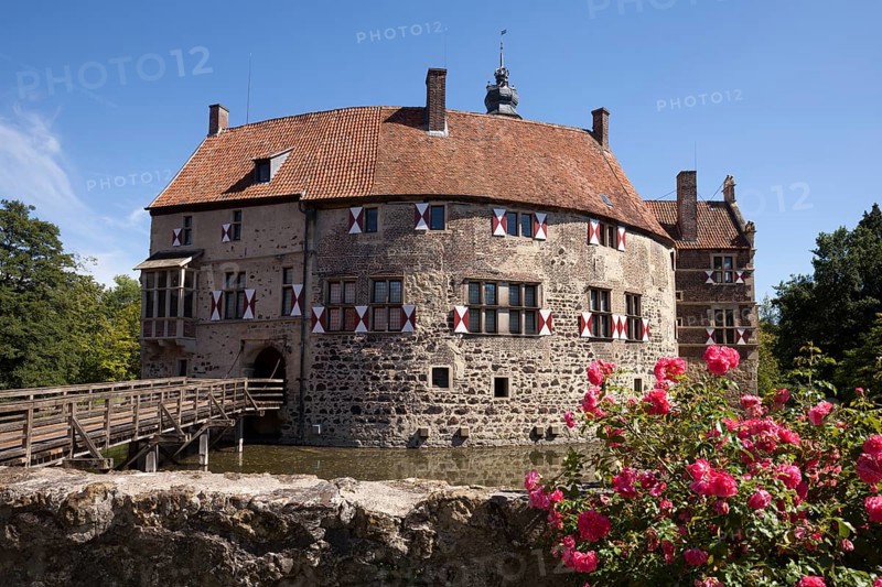 Vischering Castle with roses and moat