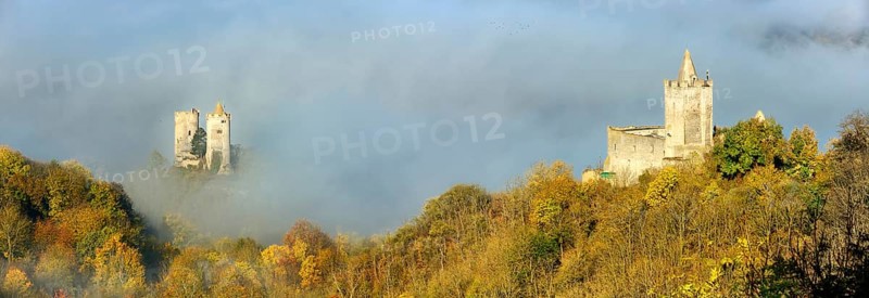 Castle ruins Saaleck and Rudelsburg in the autumn morning mist in the Saaletal valley