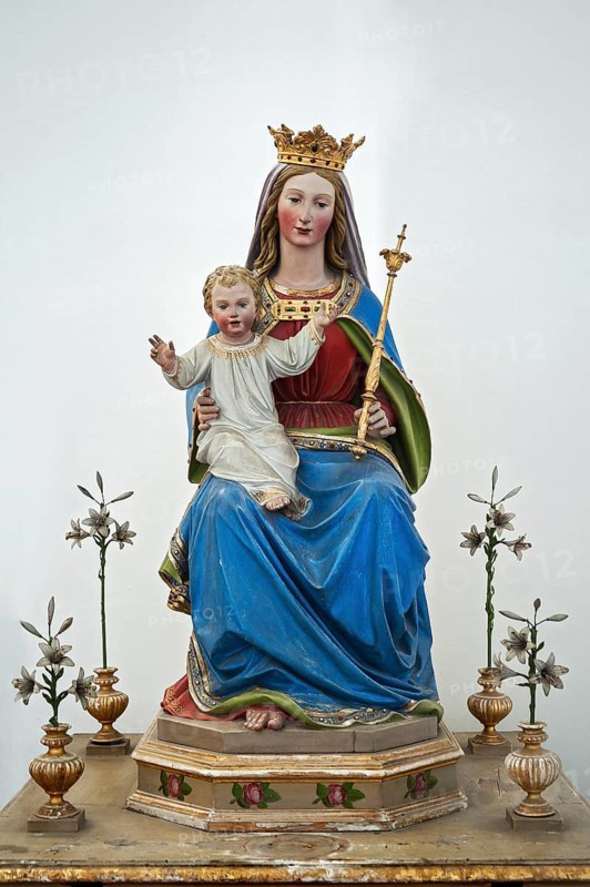 Virgin Mary holding baby Jesus with scepter and crown at the monastery Church of St. Peter and Paul in Weyarn