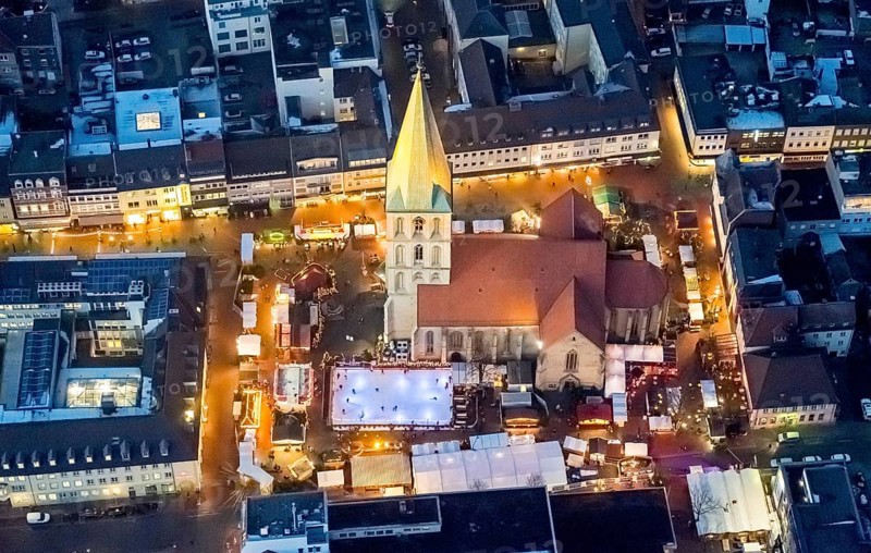 Christmas market with ice rink at St. Paul's church at night