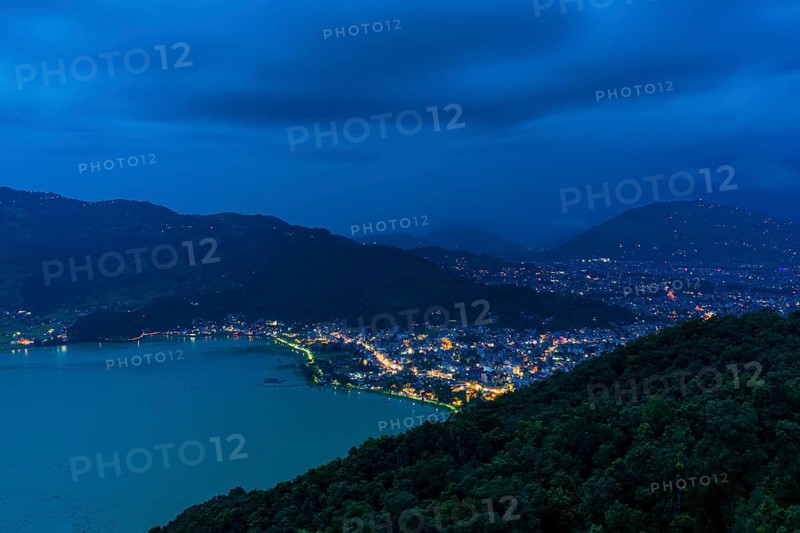 View on the illuminated city and the Phewa Lake at night