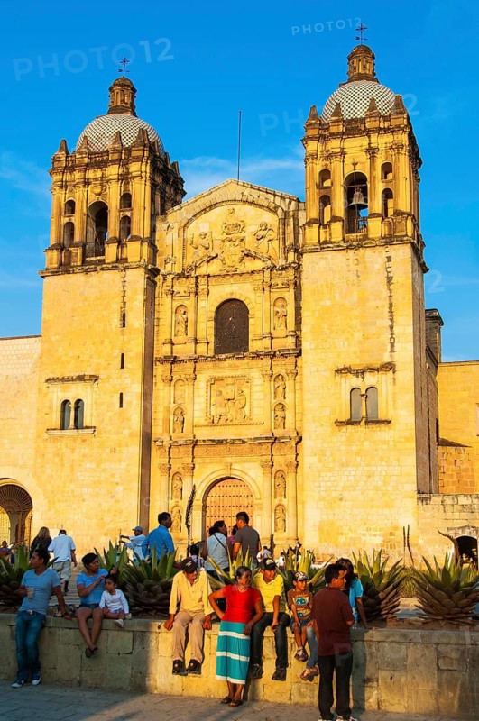Native people in front of the church of Santo Domingo de Guzman