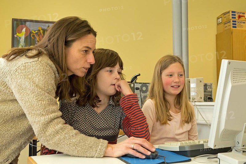 Elementary school girls working in computer room