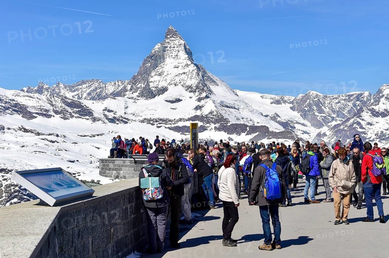 Tourists on the Gornergrat ridge with Matterhorn in the background