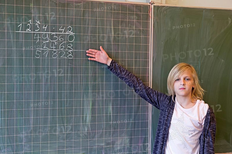Student calculating on the blackboard