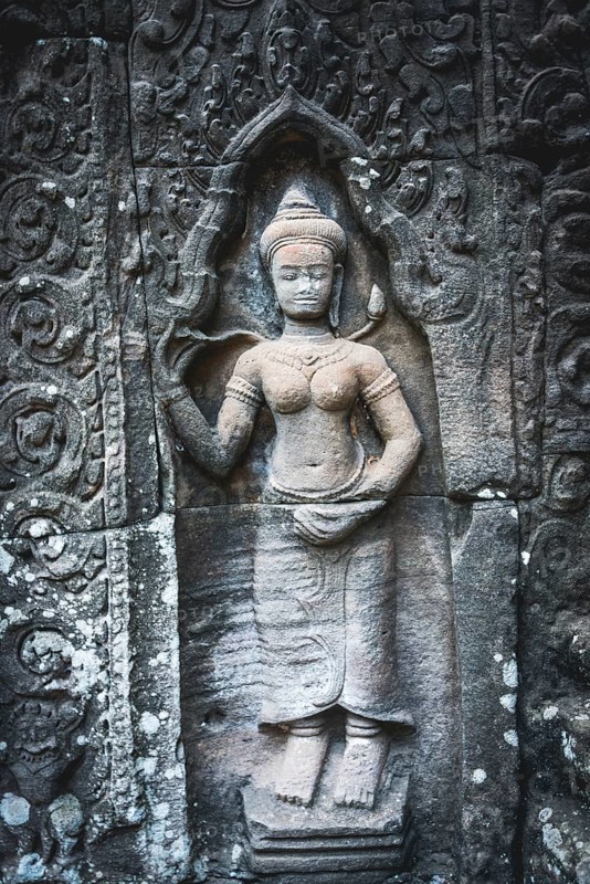 Stone relief of a divine dancer