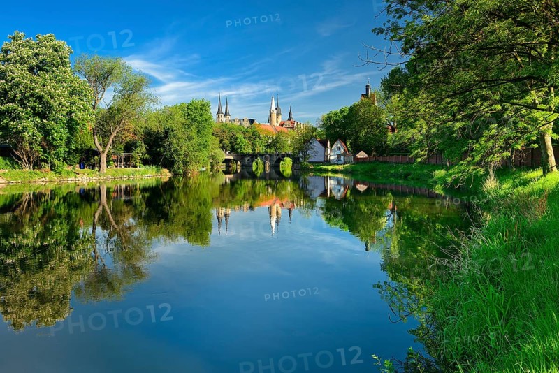 Merseburg Cathedral and Merseburg Castle are reflected in the River Saale