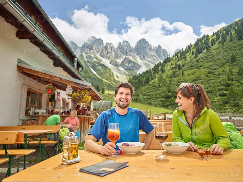 Hikers taking break at mountain hut