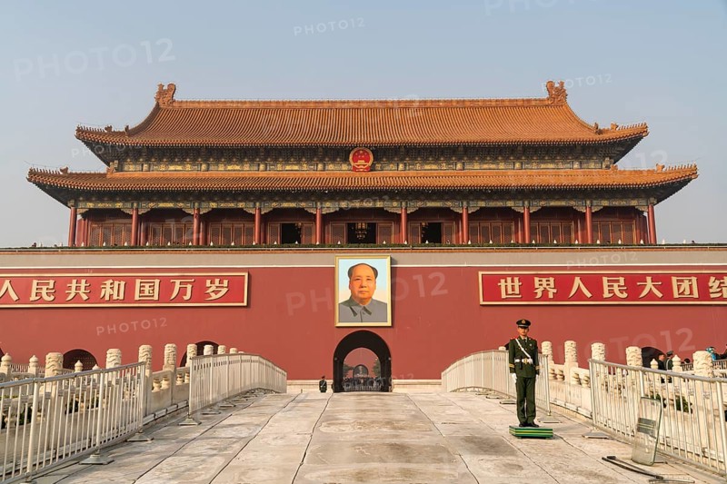Guardsman in front of portrait of Mao Zedong
