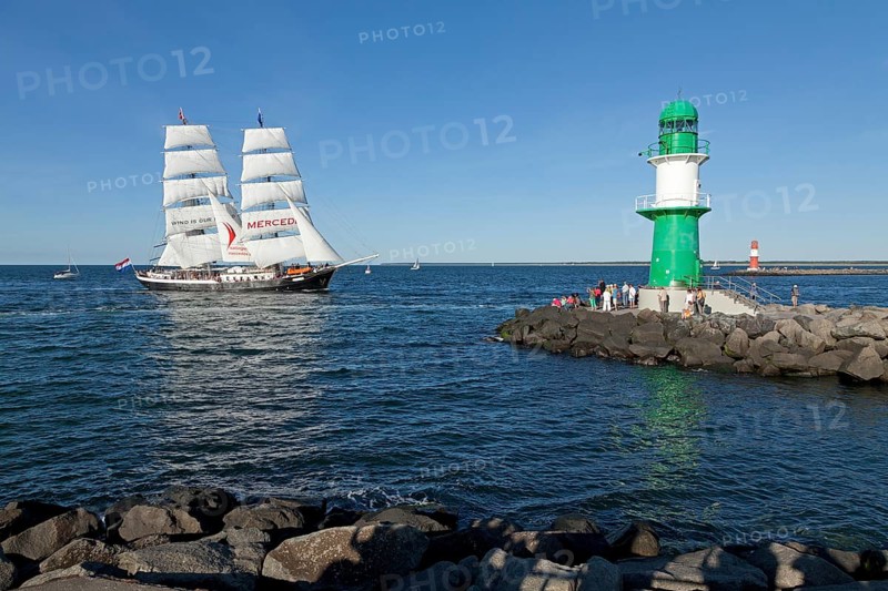 Lighthouse with sailing boat Mercedes at back