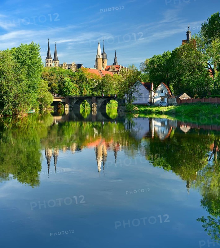 Merseburg Cathedral and Merseburg Castle are reflected in the River Saale