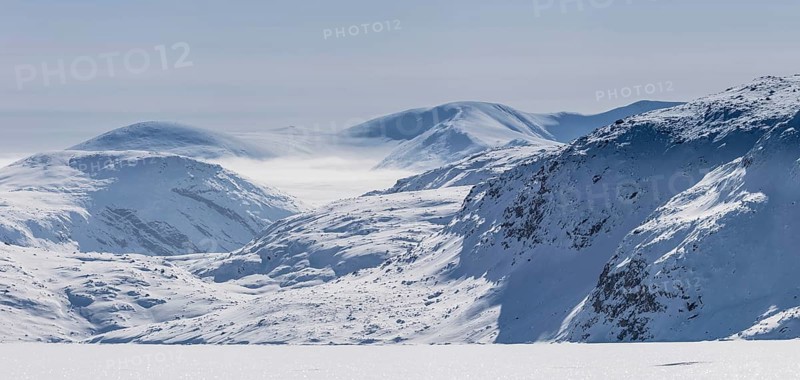 Panoramic view of mountains of Baffin seen from frozen fjord