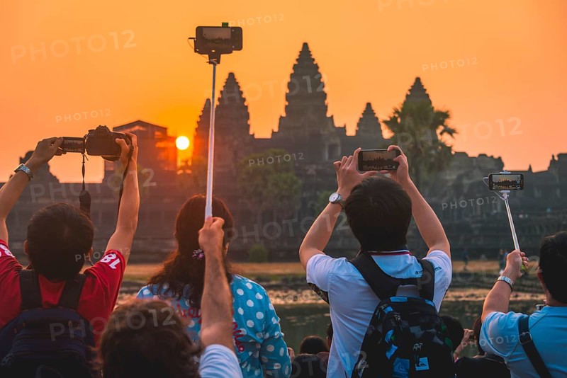 Tourists take pictures of Angkor Wat