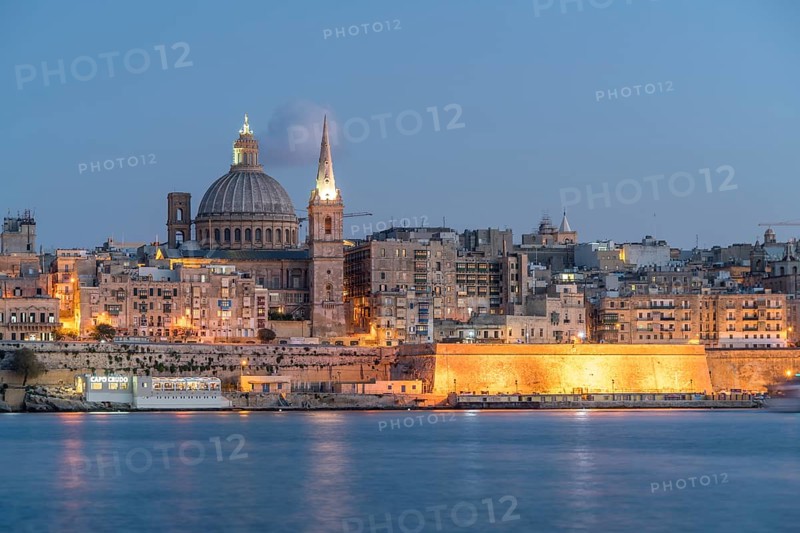 City view with St. Paul's Pro Cathedral and Carmelite Church at dusk