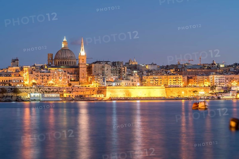 City view with St. Paul's Pro Cathedral and Carmelite Church at dusk