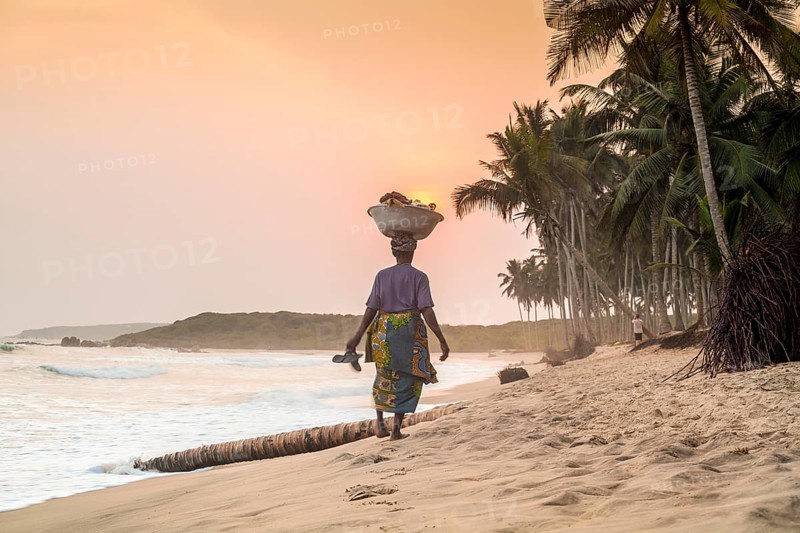 Local woman carrying goods on her head