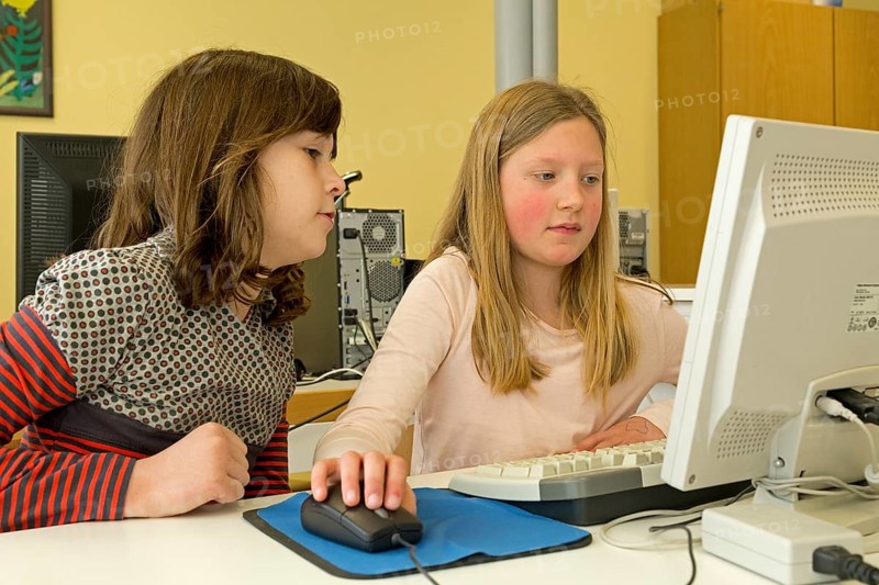 Elementary school girls working in computer room