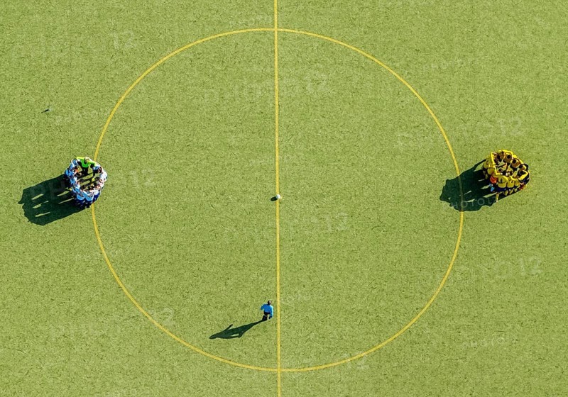 Football players at the center circle