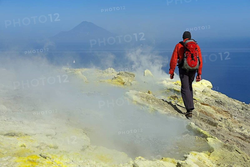Hiker on the Gran Cratere walks through sulphur fumaroles