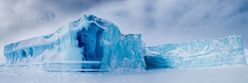 Panoramic view of icebergs seen from frozen fjord