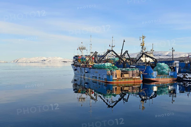 Rusty Russian fishing boats in harbor