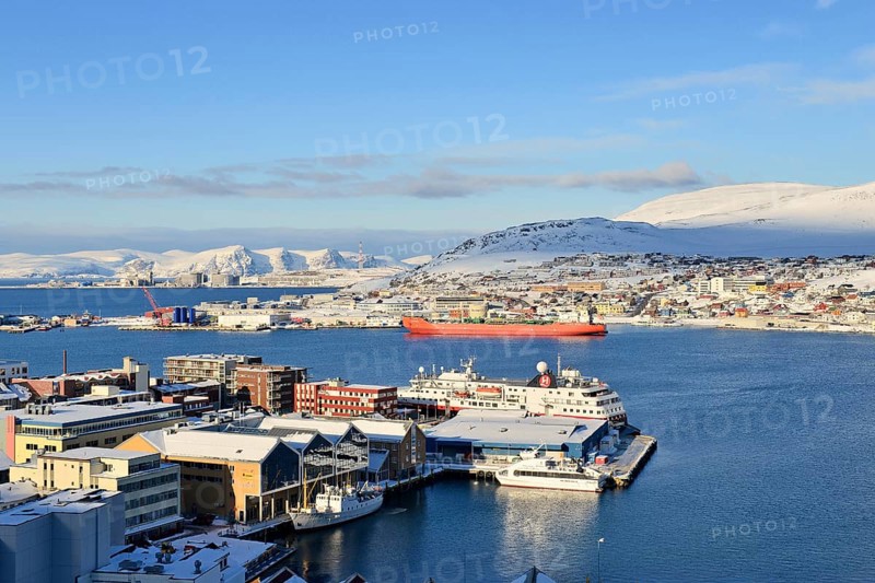Wide bay with city and Hurtigruten dock