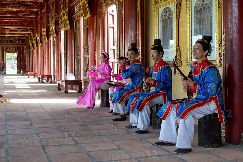 Vietnamese musicians in traditional robes of the court
