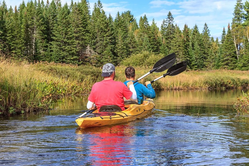 Two men paddling in a kayak
