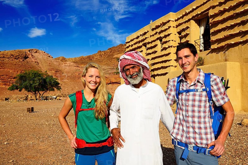 Bedouin with Tourists in front of Feynan Ecolodge