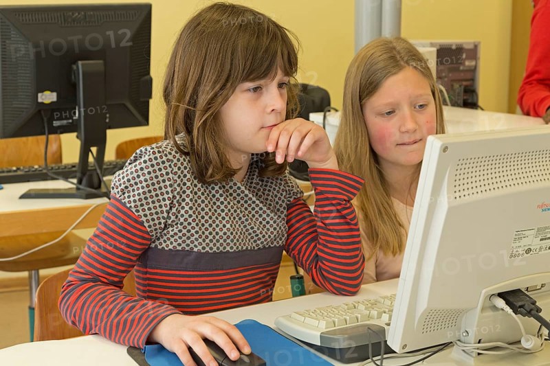 Elementary school girls working in computer room